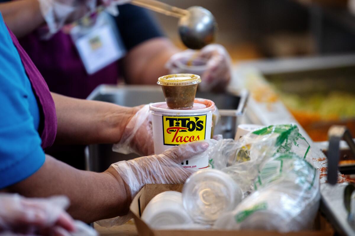 A to-go order being packaged at Tito's Tacos in Culver City