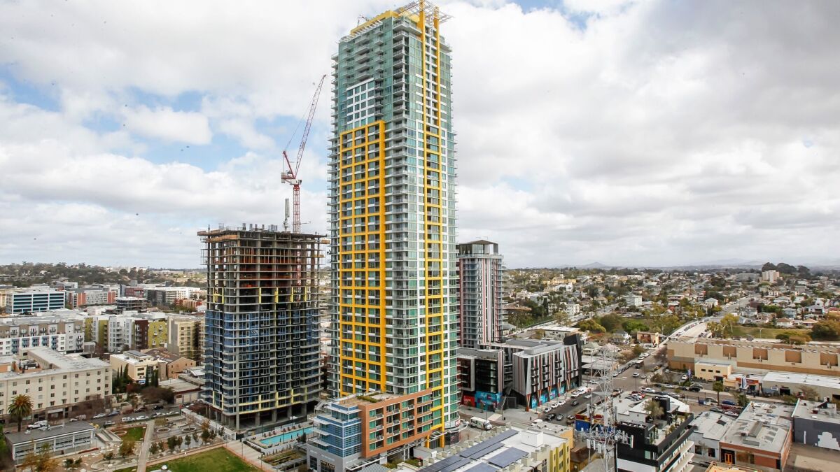 This is a view of Pinnacle and Shift apartment buildings from the 18th floor of the Alexan ALX luxury apartments at 14th and K Streets last month in Downtown San Diego, California.