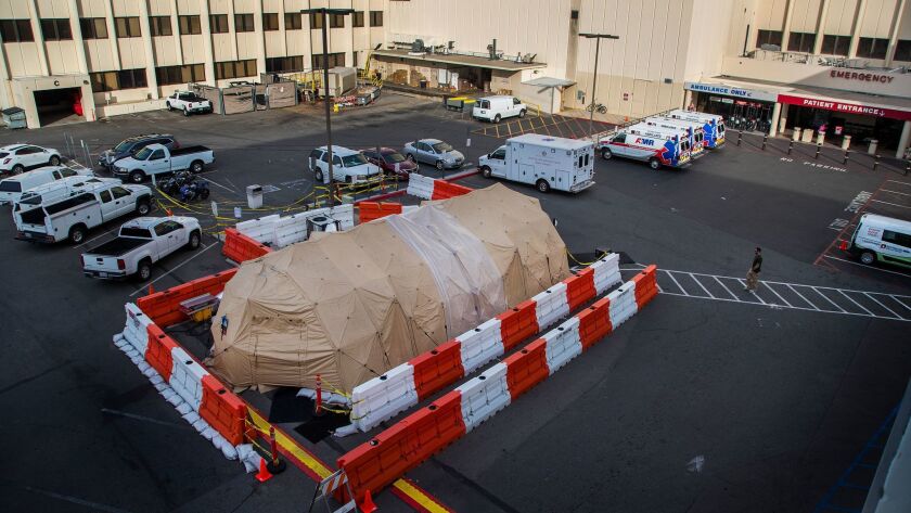A military-grade medical tent is used for overflow flu patients outside the emergency room at Loma Linda Medical Center.