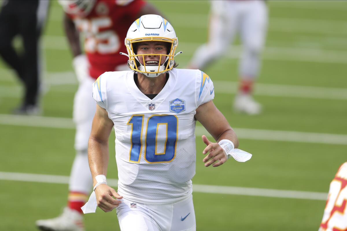 Los Angeles Chargers quarterback Justin Herbert celebrates after his first career NFL touchdown pass.