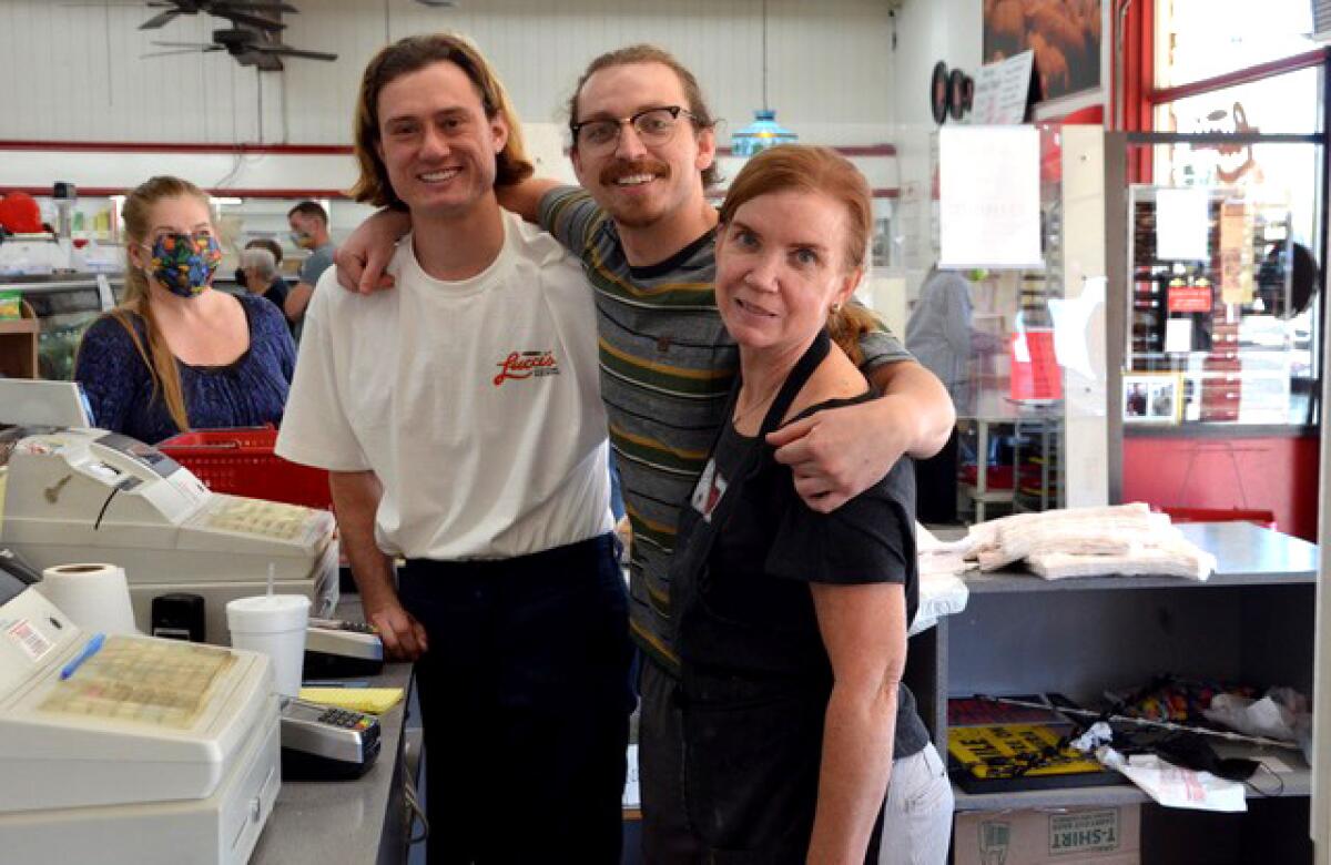 From left, Jacob Carter, Taylor Refice and his mother, Joyce, of Lucci's.