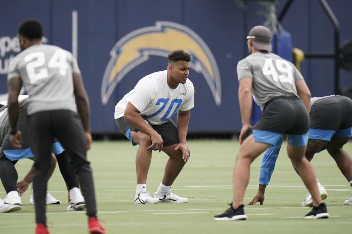 Chargers offensive tackle Rashawn Slater participates in a drill during minicamp in June.
