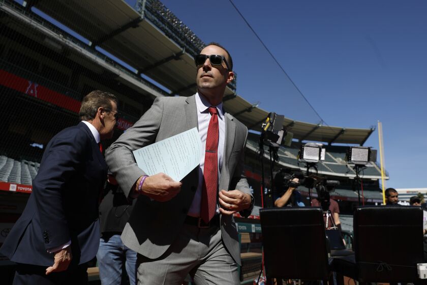 ANAHEIM, CALIF. -- THURSDAY, OCTOBER 24, 2019: General Manager Billy Eppler makes his way from the club house as the Los Angeles Angels of Anaheim introduce Joe Maddon as latest manager at a press conference held at Angel Stadium in Anaheim, Calif., on Oct. 24, 2019. (Gary Coronado / Los Angeles Times)