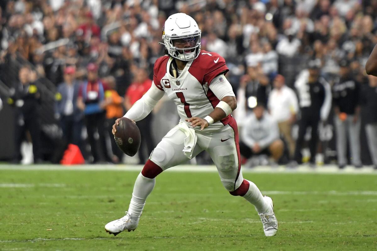 Arizona Cardinals quarterback Kyler Murray (1) scrambles.