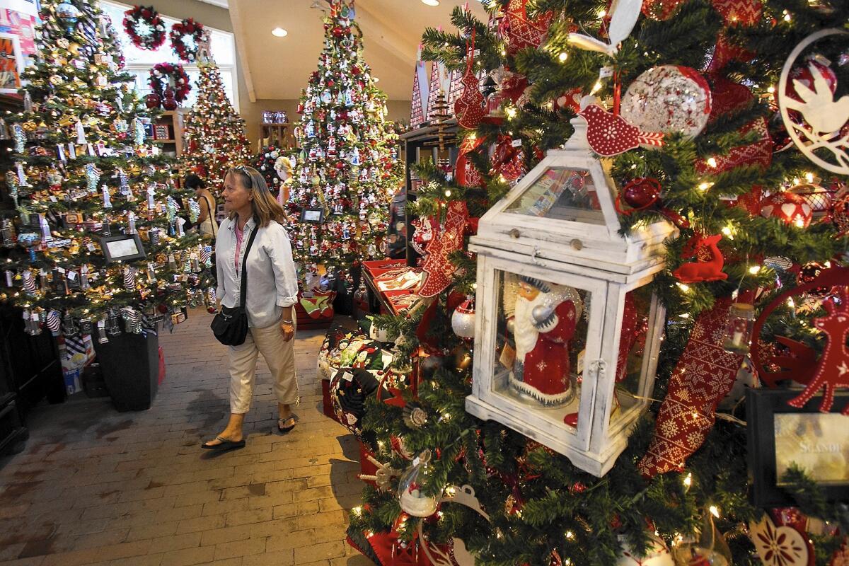 Lisa DeMirjian shops at Roger's Gardens' 2014 Christmas Boutique. This year's event opens Friday.