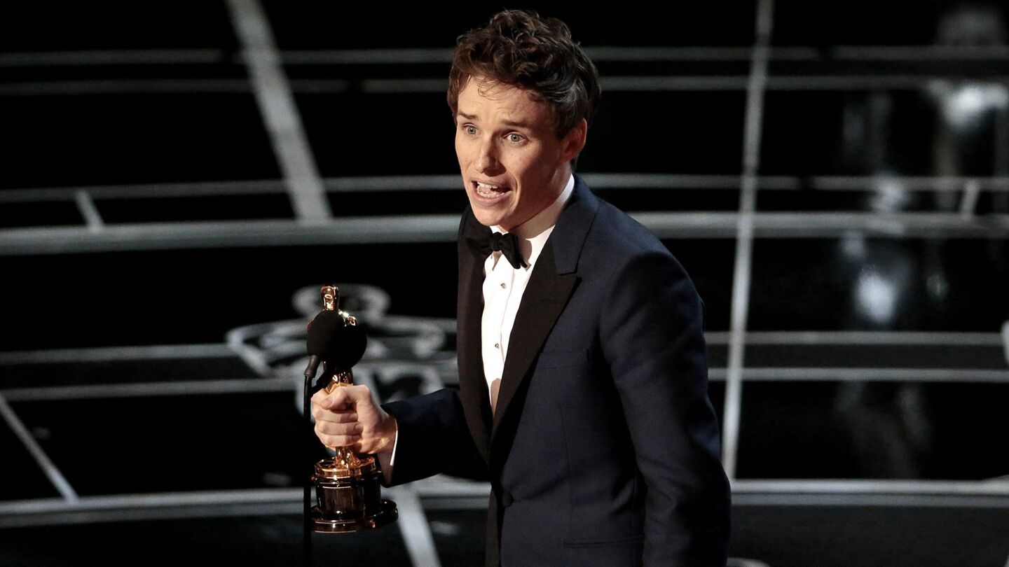 Eddie Redmayne accepts his Oscar for lead actor for "The Theory of Everything."