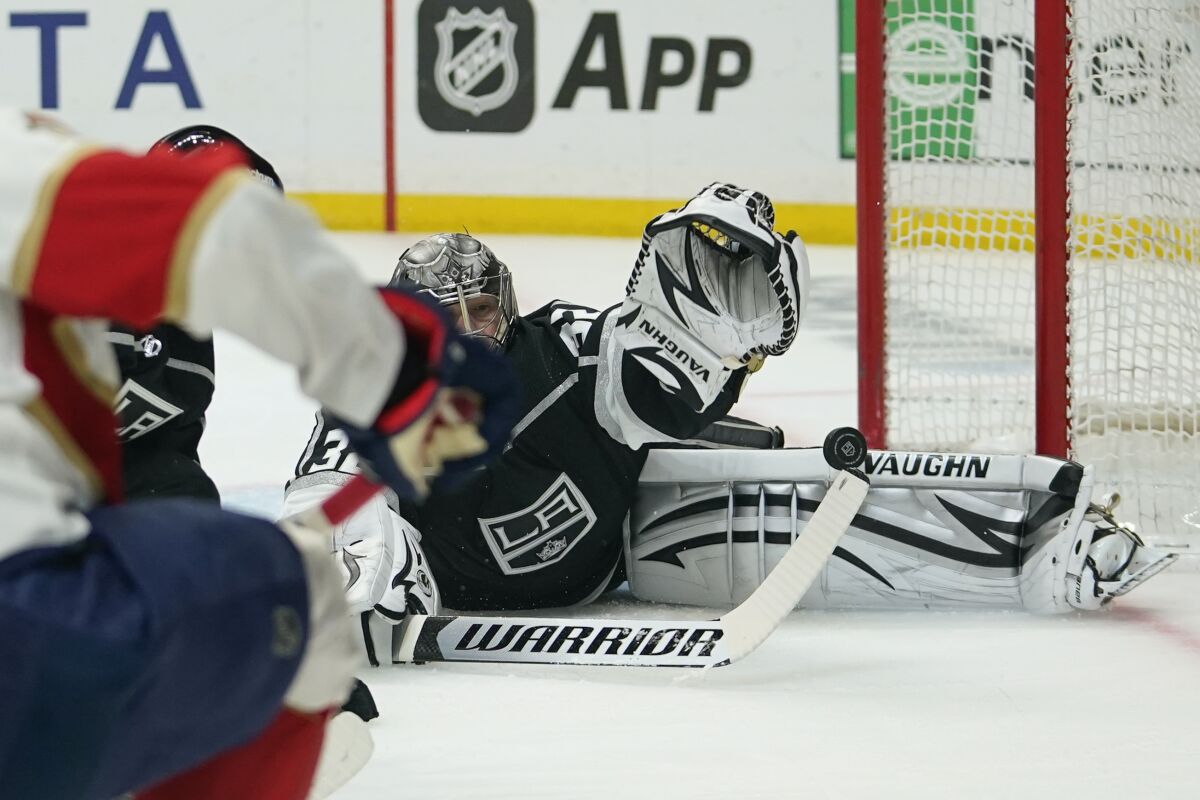 Los Angeles Kings goaltender Jonathan Quick (32) stops a shot from Florida Panthers left wing Anthony Duclair (10) during the first period of an NHL hockey game Sunday, March 13, 2022, in Los Angeles. (AP Photo/Ashley Landis)
