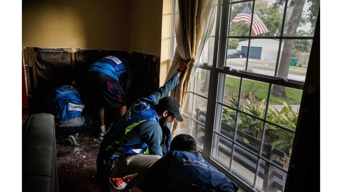 Volunteers attended prayer services in the morning, then helped storm victims haul away damaged furniture and other items from homes in the suburban Houston neighborhood.