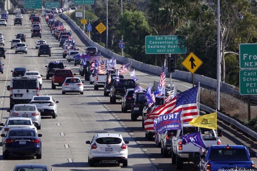 A caravan in support of President Donald Trump rolls into San Diego