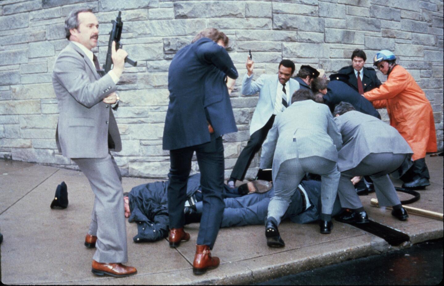 Secret Service agents react after an assassination attempt on President Ronald Reagan on March 30, 1981, by John Hinckley Jr. outside the Hilton Hotel in Washington, D.C. Also wounded in the shooting were press secretary James Brady, Secret Service Agent Tim McCarthy and D.C. police Officer Thomas Delahanty. Hinckley was found not guilty by reason of insanity in 1982 and placed in a mental health care facility.