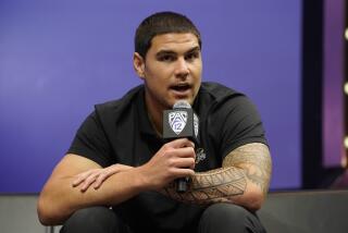 UCLA defensive lineman/linebacker Laiatu Latu speaks at an NCAA college football Pac-12 media day.