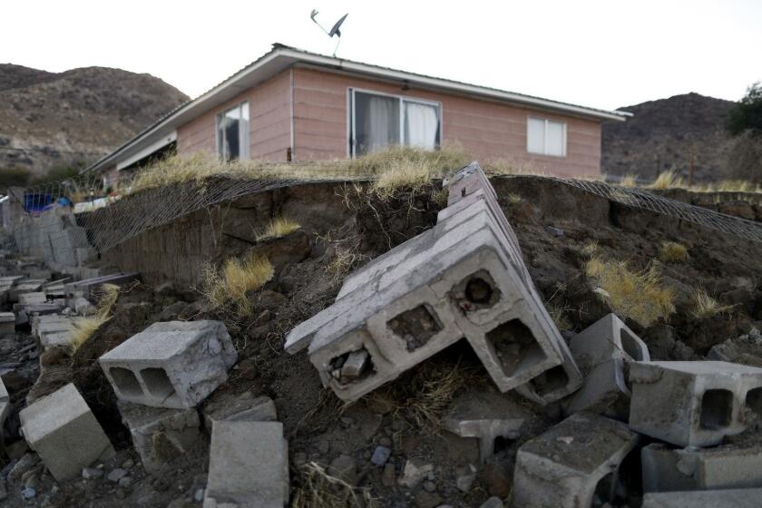 TRONA, CALIFORNIA - JULY 08: Cinderblocks from a toppled wall are scattered outside the Eldridge family home, which has been deemed uninhabitable due to structural damage from the recent 7.1 magnitude earthquake, on July 8, 2019 in Trona, California. Homeowners Benny and Anna Sue Eldridge, husband and wife, are currently sleeping outside the home with other family members on mattresses and in trucks for safety. Firefighters told them a stronger earthquake could cause the house to collapse. Anna Sue's father constructed the home with Benny's help in 1961. During the daytime they have been packing furniture, heirlooms and other items to place into storage as they try to decide where they will live next or if they will rebuild. (Photo by Mario Tama/Getty Images) ** OUTS - ELSENT, FPG, CM - OUTS * NM, PH, VA if sourced by CT, LA or MoD **