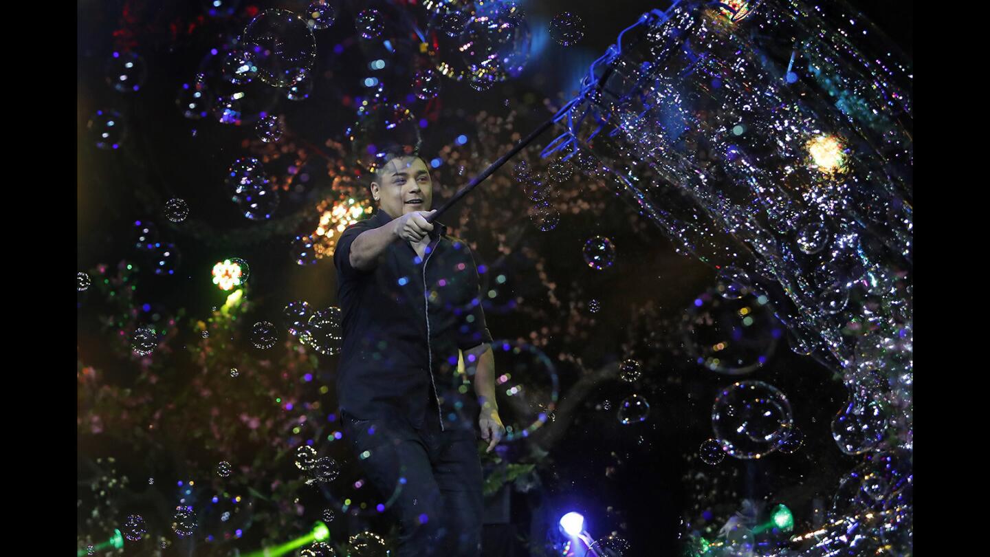 Bubble artist Deni Yang performs during the Mega Bubblefest Laser Show at Discovery Cube Orange County in Santa Ana on Saturday, March 24.