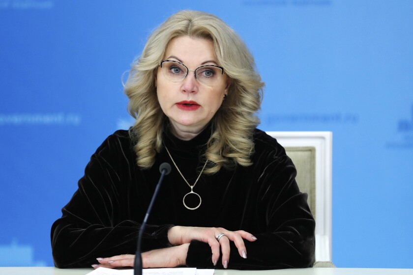 FILE - Russian Deputy Prime Minister Tatyana Golikova speaks to the media in Moscow, Russia, Dec. 10, 2020. The Russian government has decided to delay a controversial bill requiring QR codes confirming vaccination or recovery from COVID-19 to access public places, despite surging cases and warnings from top officials about the highly infectious omicron variant. Deputy Prime Minister Tatyana Golikova said on Friday, Jan. 14, 2022 the legislation was postponed due to the “high uncertainty” as the draft bill was originally prepared in response to the delta variant but “new challenges” have arisen.(Dmitry Astakhov/Sputnik, Kremlin Pool Photo via AP, File)