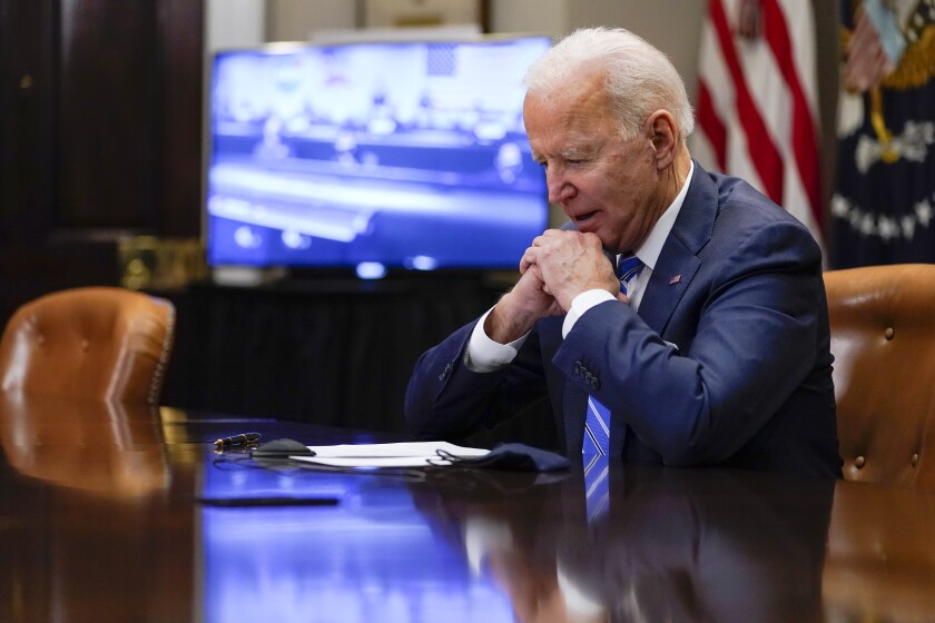 President Biden speaks on the phone in the Roosevelt Room