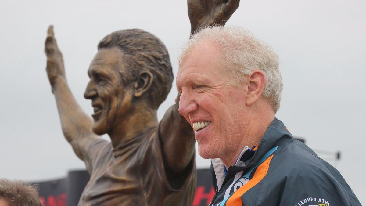 Bill Walton stands with the new bronze statue of himself during its unveiling event in May at Mission Bay's Ski Beach.
