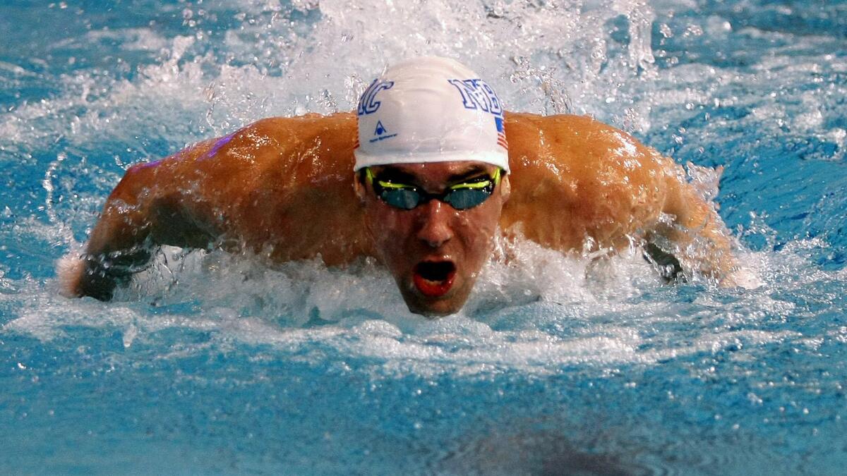 Michael Phelps competes in the 100-meter butterfly at the American Short Course Championships on March 5. Phelps' result did not count because he was under suspension from USA Swimming.