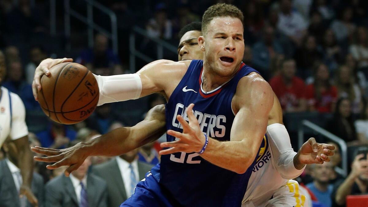Los Angeles Clippers forward Blake Griffin drives to the basket against Golden State Warriors guard Patrick McCaw during the first half.