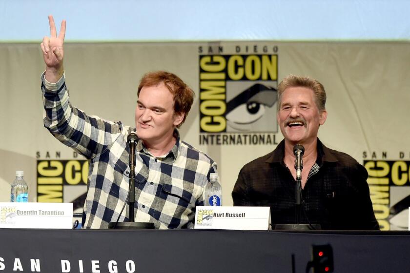 Writer/director Quentin Tarantino, left, and actor Kurt Russell speak onstage at Quentin Tarantino's "The Hateful Eight" panel during Comic-Con International 2015.