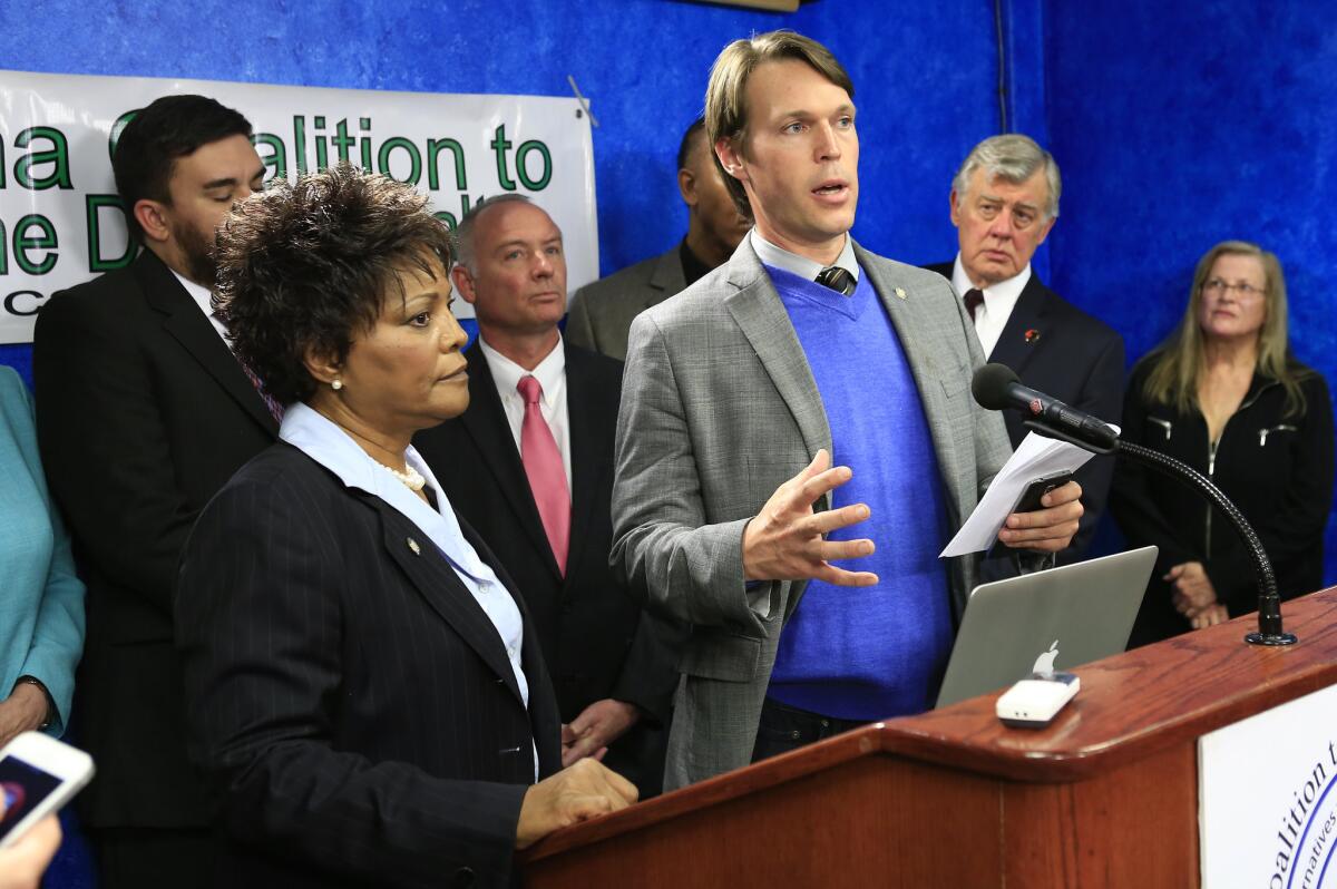 Oklahoma State Senator Connie Johnson, left, and Rep. Seneca Scott issue a statement on the Execution of Clayton Lockett from the Oklahoma State Capitol.