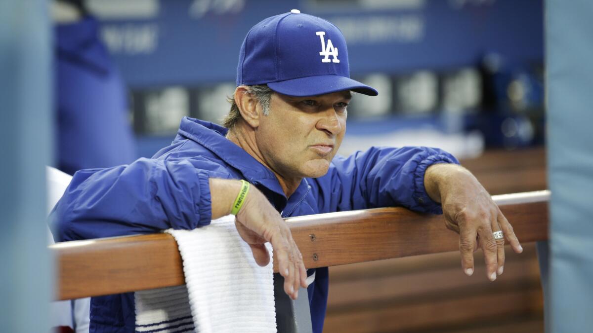 Dodgers Manager Don Mattingly looks on from the dugout during a game against the Philadelphia Phillies in April. Mattingly has grown frustrated with the team's ongoing struggles.