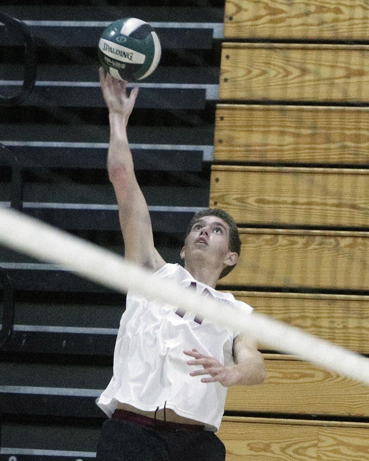 Laguna Beach's Andrew Reavis records a kill against Edison in a pool-play match of the Orange County Championships on Friday.