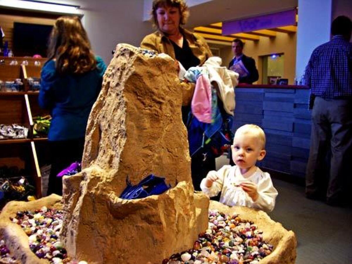 SMOOTH: The Fort Worth Museum of Science and History has cutting-edge exhibits for kids. A young museum store shopper checks out some polished stones.