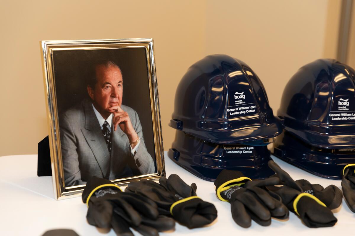 A picture of Gen. William Lyon and construction helmets.