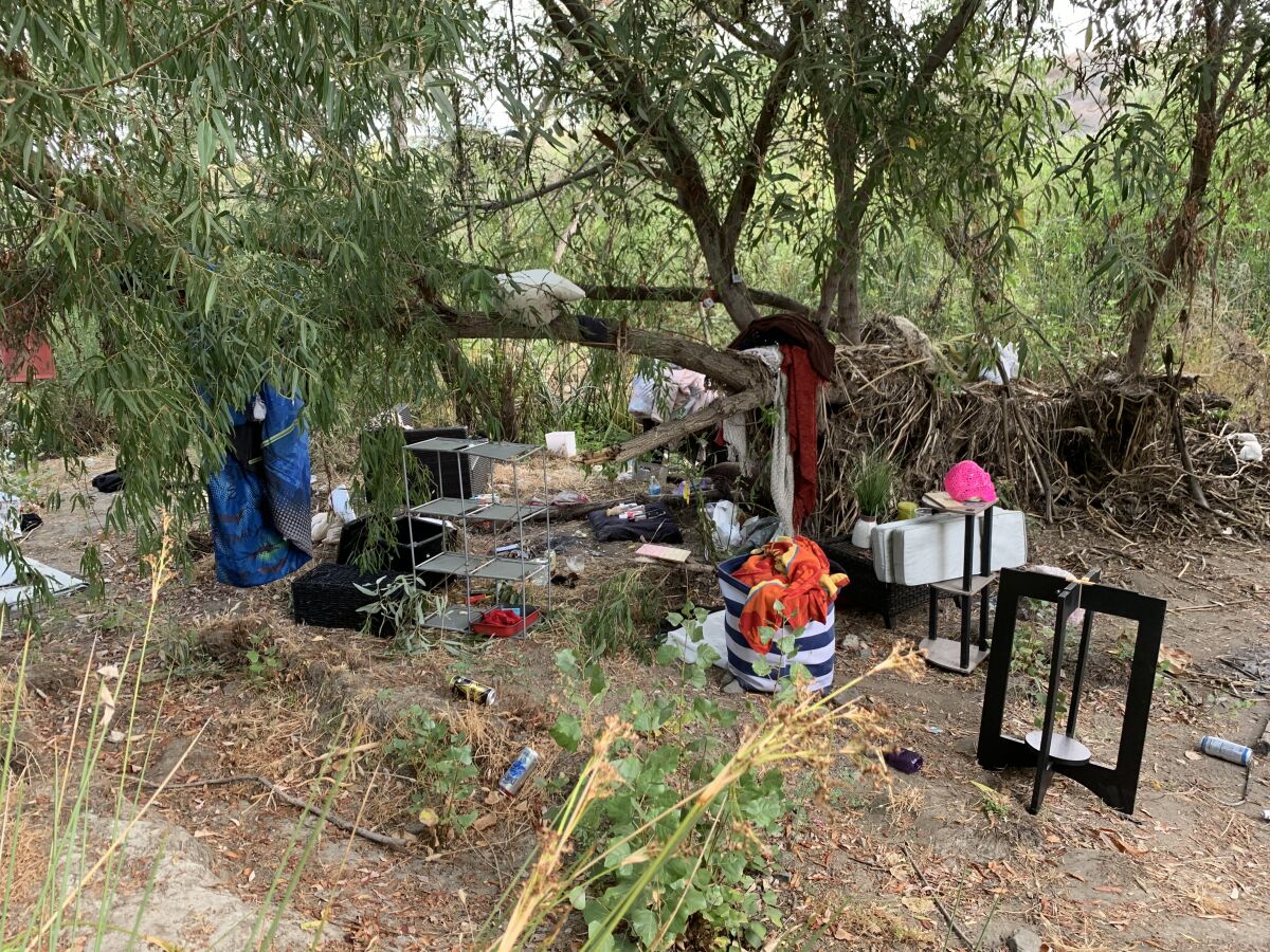 A homeless encampment in Santee by the San Diego River in August 2022.