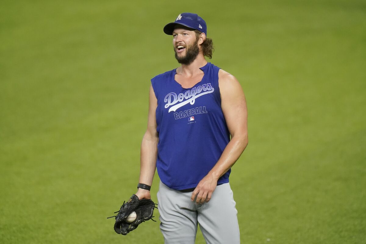 Los Angeles Dodgers starting pitcher Clayton Kershaw works out before Game 3 of a baseball National League Championship Series against the Atlanta Braves Wednesday, Oct. 14, 2020, in Arlington, Texas. (AP Photo/Eric Gay)