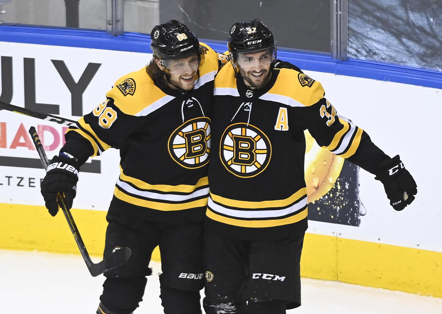 Bergeron scores in 2nd OT, Bruins beat Hurricanes in Game 1