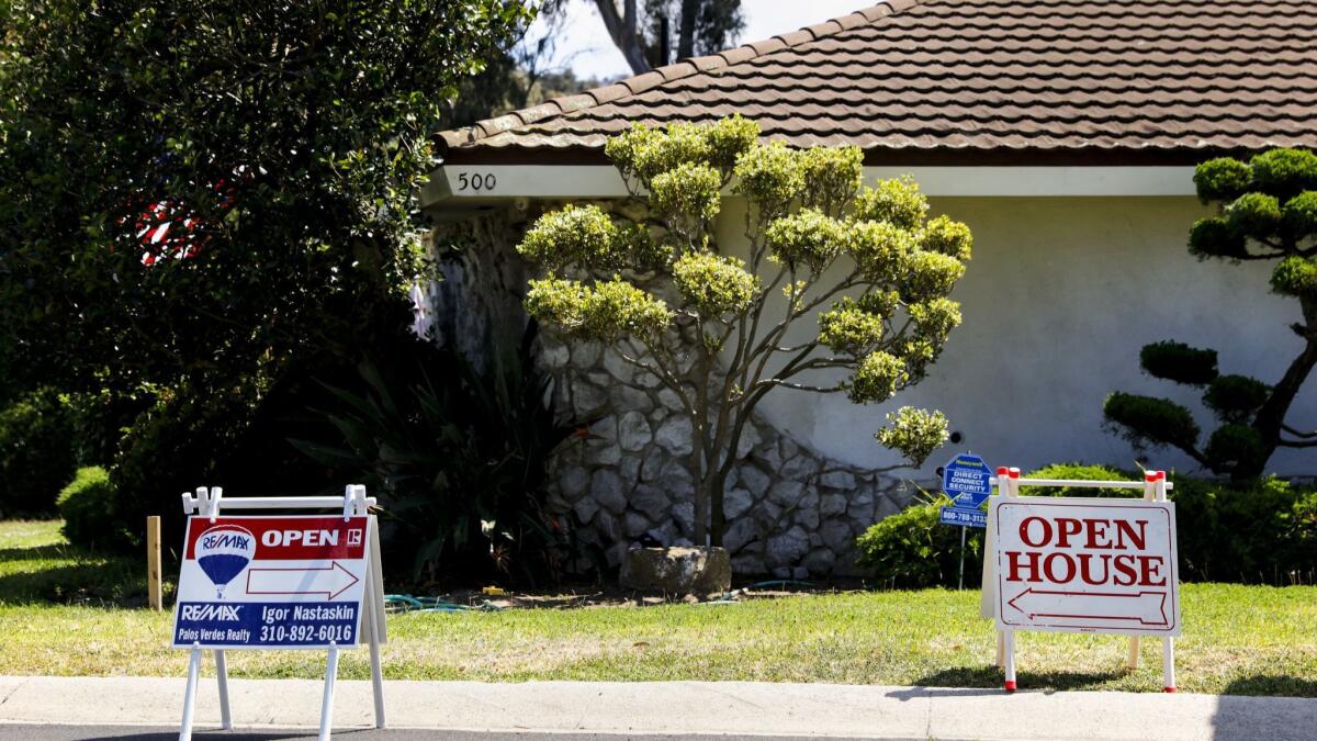 Signs point the way for open houses in Torrance.