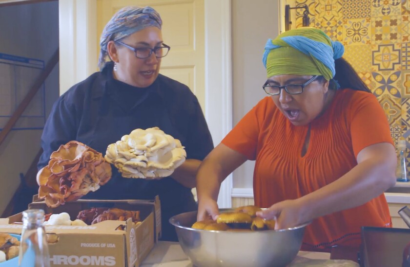 In the documentary film "The Kitchenistas," a participant in the "Cooking for Salud" program learns to work with mushrooms.