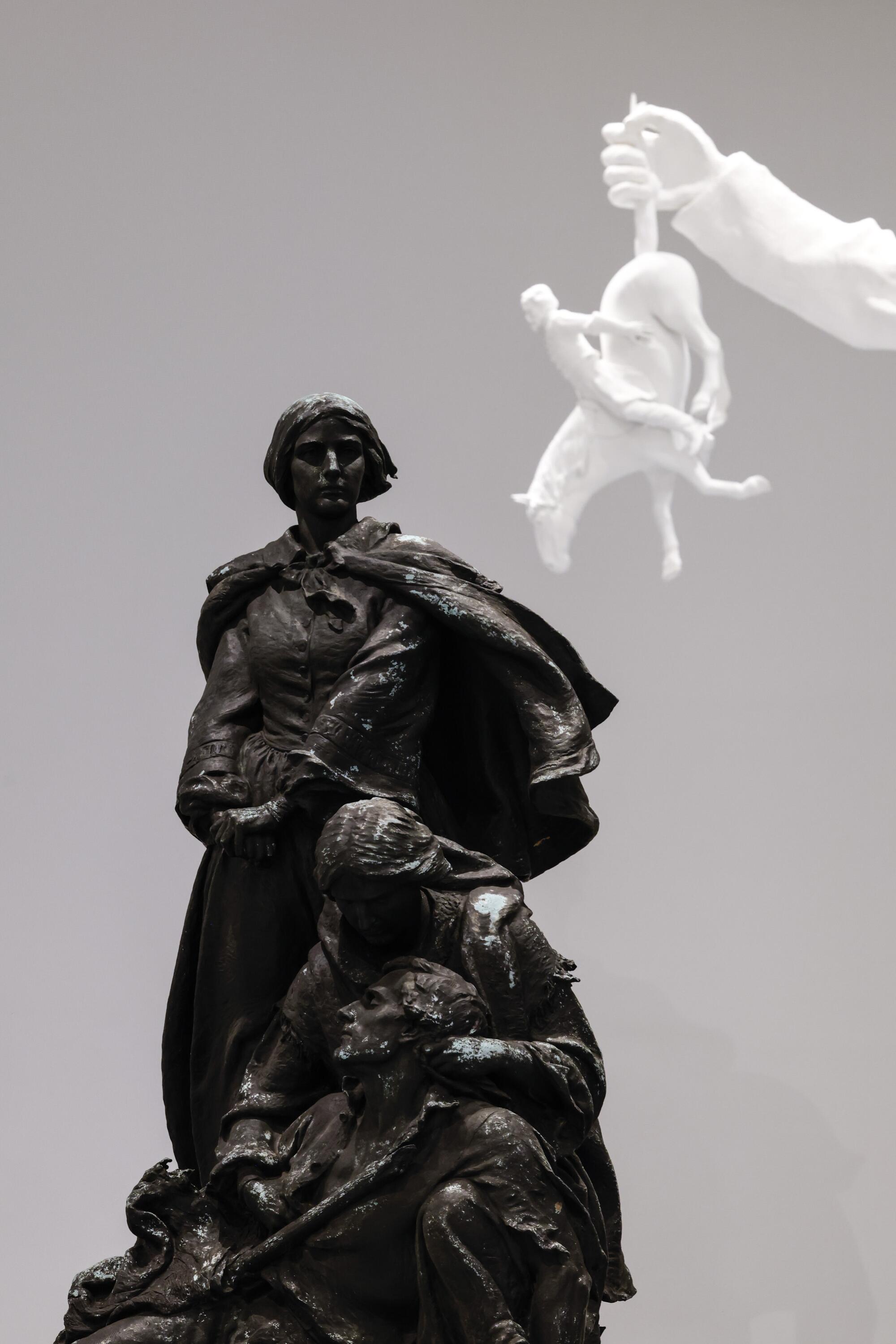 J. Maxwell Miller's "Confederate Women of Maryland," with the hand of Karon Davis' “Descendant."