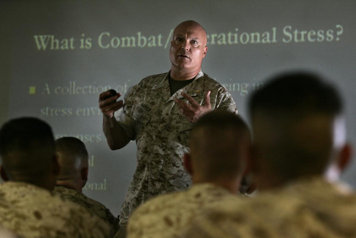 Navy Cmdr. Paul Hammer addresses a class of Marines at Camp Pendleton on how to deal with combat and operational stresses. A new study, using mice, suggests coping skills could be passed on from stressed-out dads, through an epigenetic process.