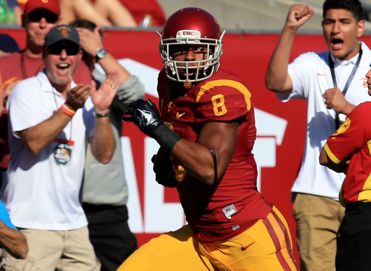 USC wide receiver George Farmer breaks away for one of his two touchdowns against Notre Dame back in November.