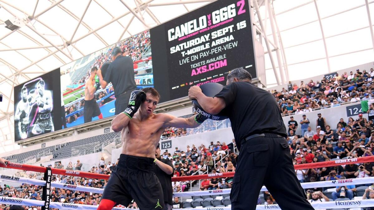 Gennady "GGG" Golovkin works with trainer Abel Sanchez during a media workout before his fight against Canelo Alvarez.