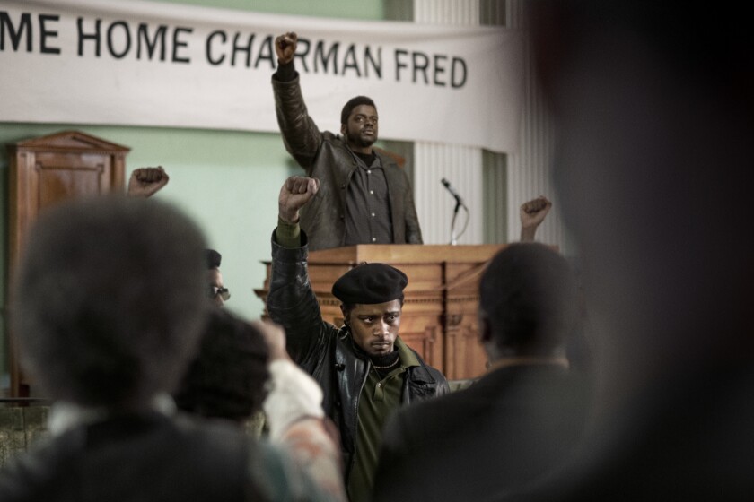 This image released by Warner Bros. Pictures shows LaKeith Stanfield, foreground, and Daniel Kaluuya in a scene from the upcoming film "Judas and the Black Messiah." The Ryan Coogler-produced Fred Hampton film will have its premiere at the Sundance Film Festival before heading to HBO Max and theaters, programmers announced Tuesday. Daniel Kaluuya plays the Black Panther Party chairman and his “Get Out” co-star Lakeith Stanfield plays FBI Informant William O’Neill who agrees to infiltrate the group in the late 1960s. (Glen Wilson/Warner Bros. Entertainment via AP)