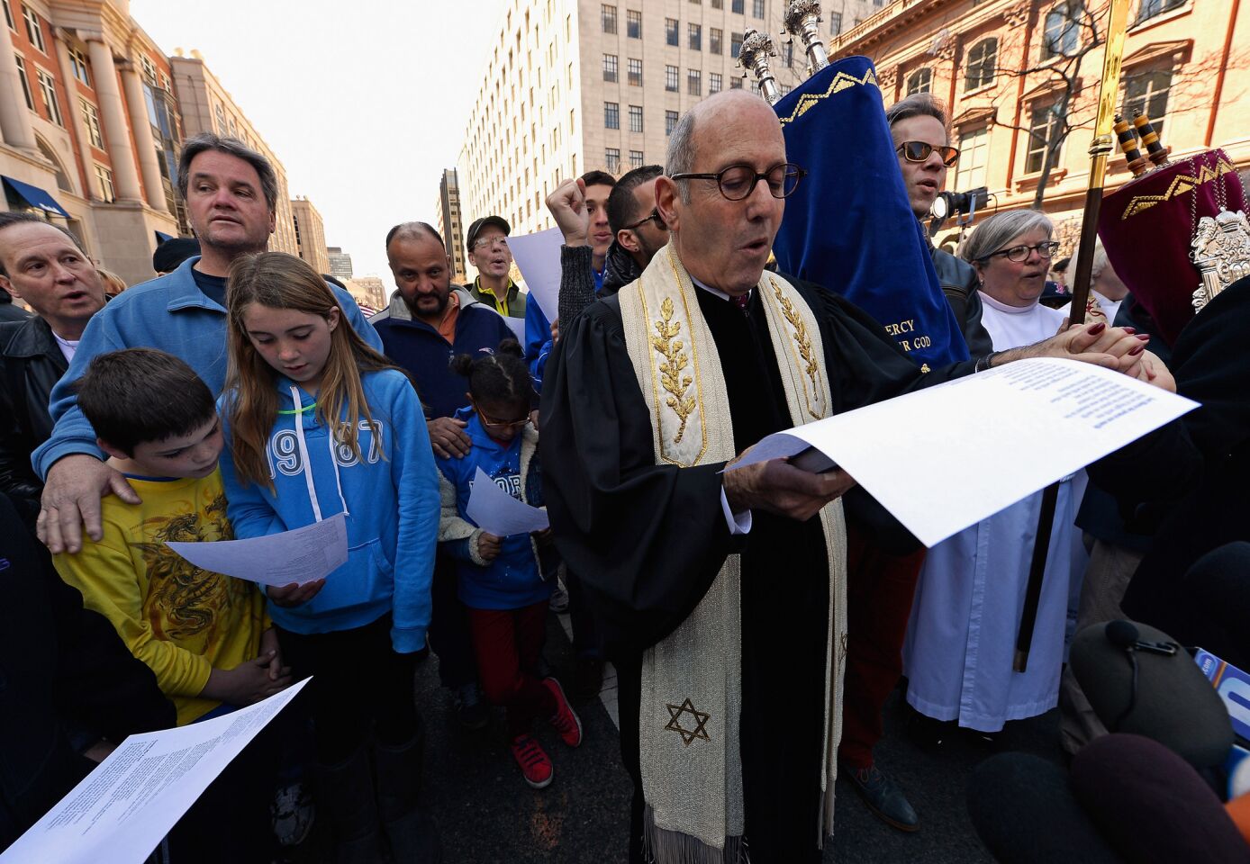 Rabbi Howard Berman of Central Reform Temple participates in an interfaith memorial service near a makeshift memorial for victims of the Boston Marathon bombings.