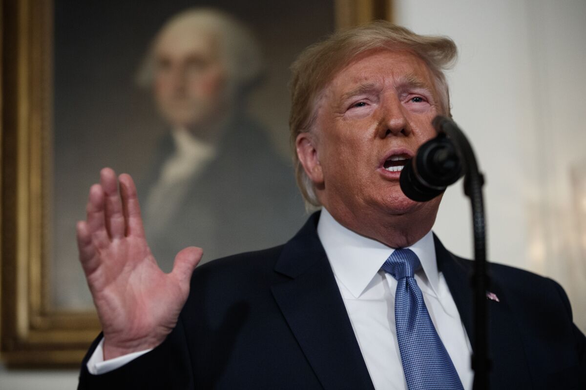 President Donald Trump speaks in the Diplomatic Reception Room of the White House in 2019. (AP Photo/Evan Vucci)