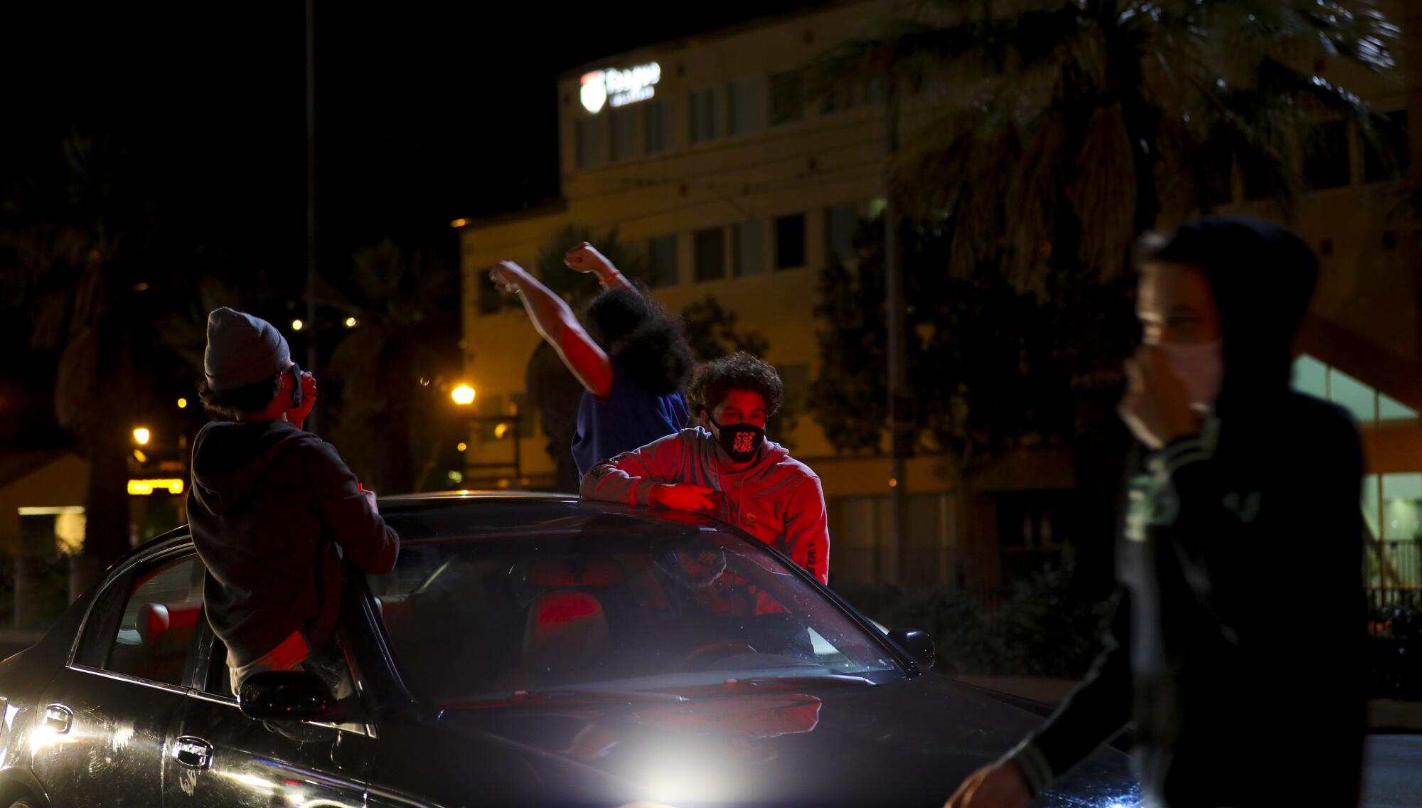 Some protestors demonstrated from their cars along Spring Street in La Mesa on Saturday.