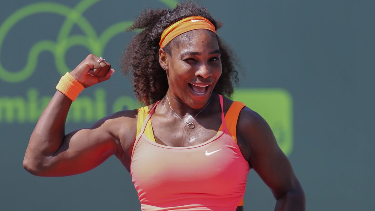 Serena Williams strikes a pose while celebrating her 700th career victory Wednesday at the Miami Open.