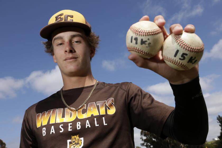 OCEANSIDE, CA - APRIL 24, 2024: El Camino pitcher Zane Nordquist holds his two no-hitter baseballs during practice at El Camino High School in Oceanside on Wednesday, April 24, 2024.