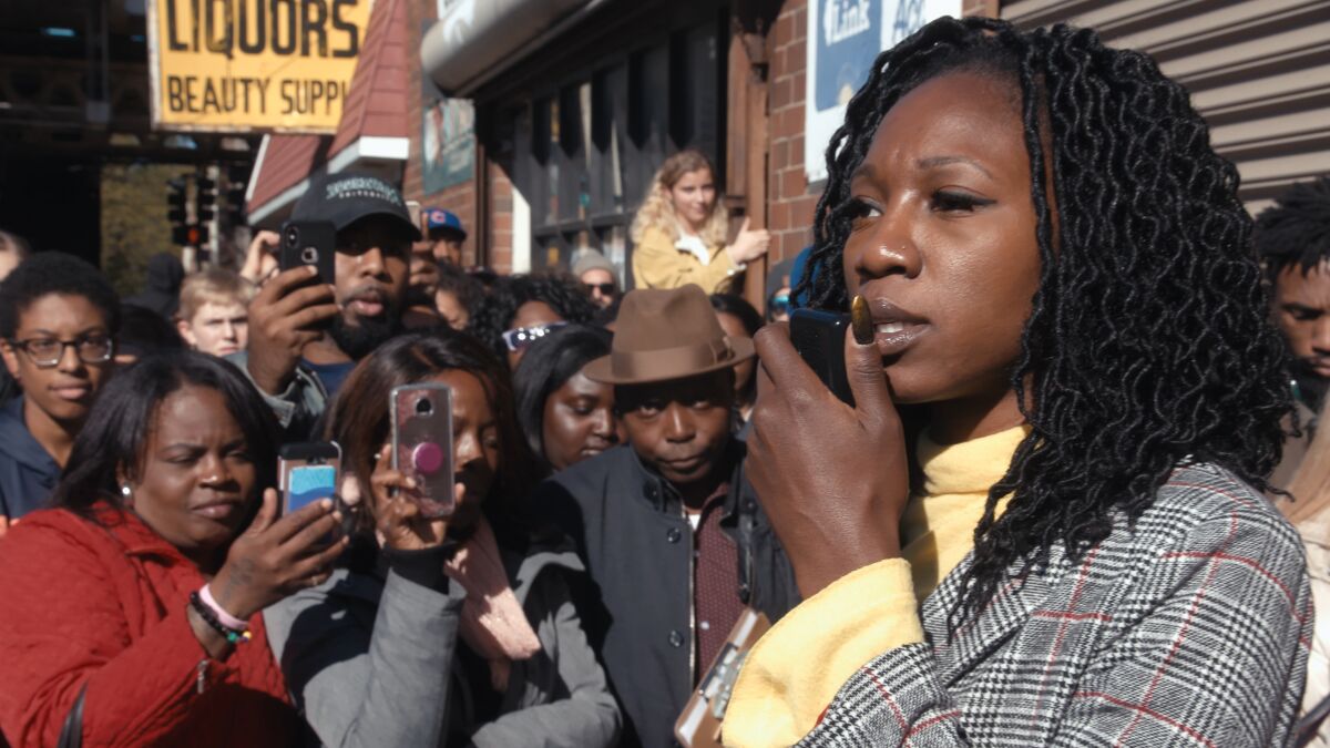 Amara Enyia holds a news conference with Chance the Rapper and Kanye West in Southside Chicago. 