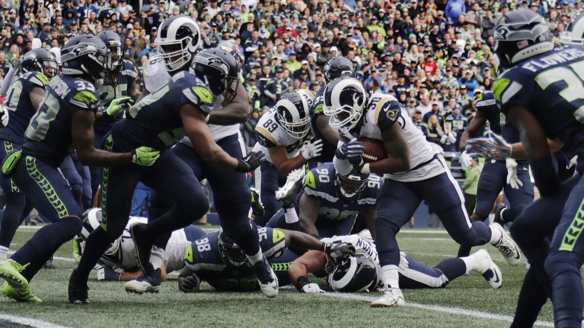 Rams running back Todd Gurley (30) finds a hole in the Seattle Seahawks defense to score in the fourth quarter.