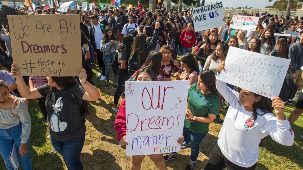 Students who walked out of their classrooms at Ocean View High School in Huntington Beach on Thursday protest President Trump's plan to end the DACA program after six months.