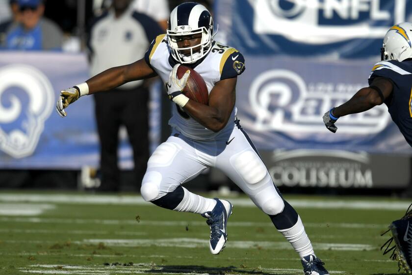 Los Angeles Rams running back Malcolm Brown runs with the ball during the first half of a preseason NFL football game against the Los Angeles Chargers Saturday, Aug. 26, 2017, in Los Angeles. (AP Photo/Mark J. Terrill)