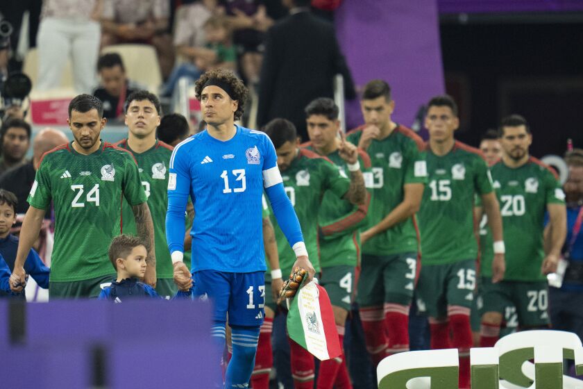 Mexico's goalkeeper Guillermo Ochoa leads his team onto the pitch prior to the World Cup group C soccer match between Saudi Arabia and Mexico, at the Lusail Stadium in Lusail, Qatar, Wednesday, Nov. 30, 2022. (AP Photo/Julio Cortez)