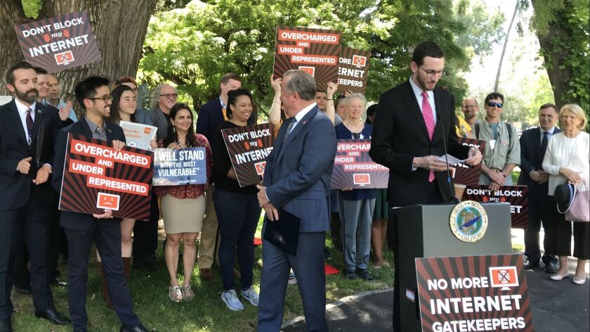California Sen. Scott Wiener (D-San Francisco) reads a list of consumer and open internet advocacy groups who came to Sacramento on May 29 to lobby the Legislature on a net-neutrality bill as a Senate deadline looms.