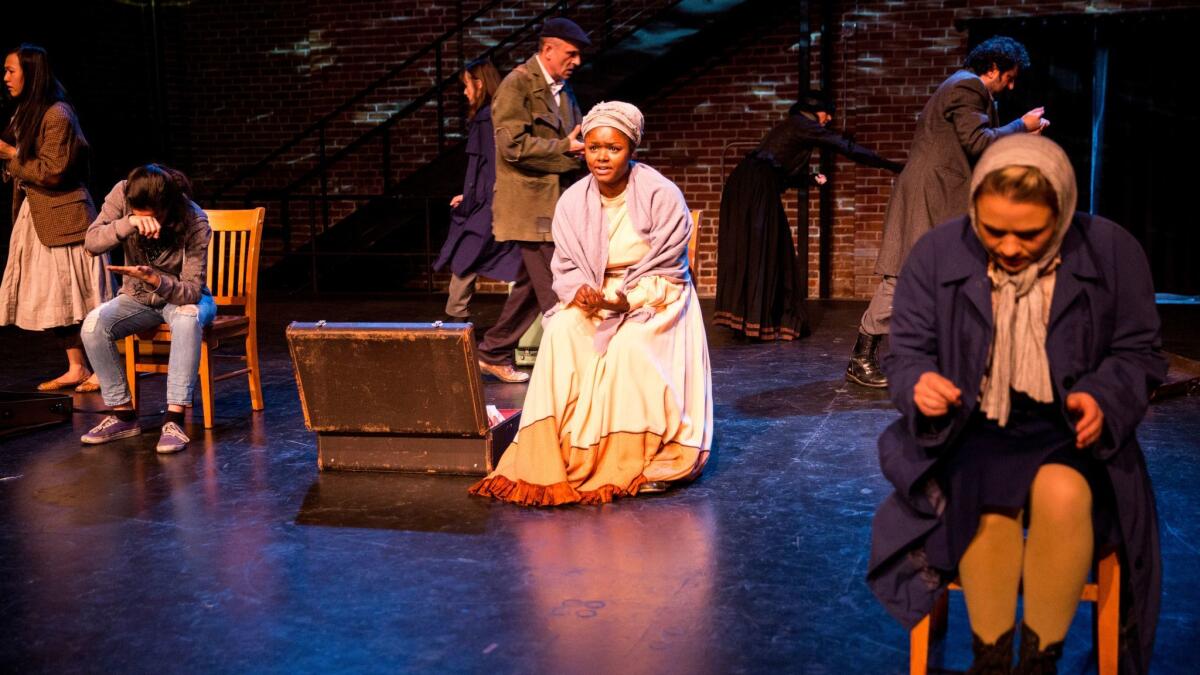 Cast members of "The New Colossus" perform during a dress rehearsal.